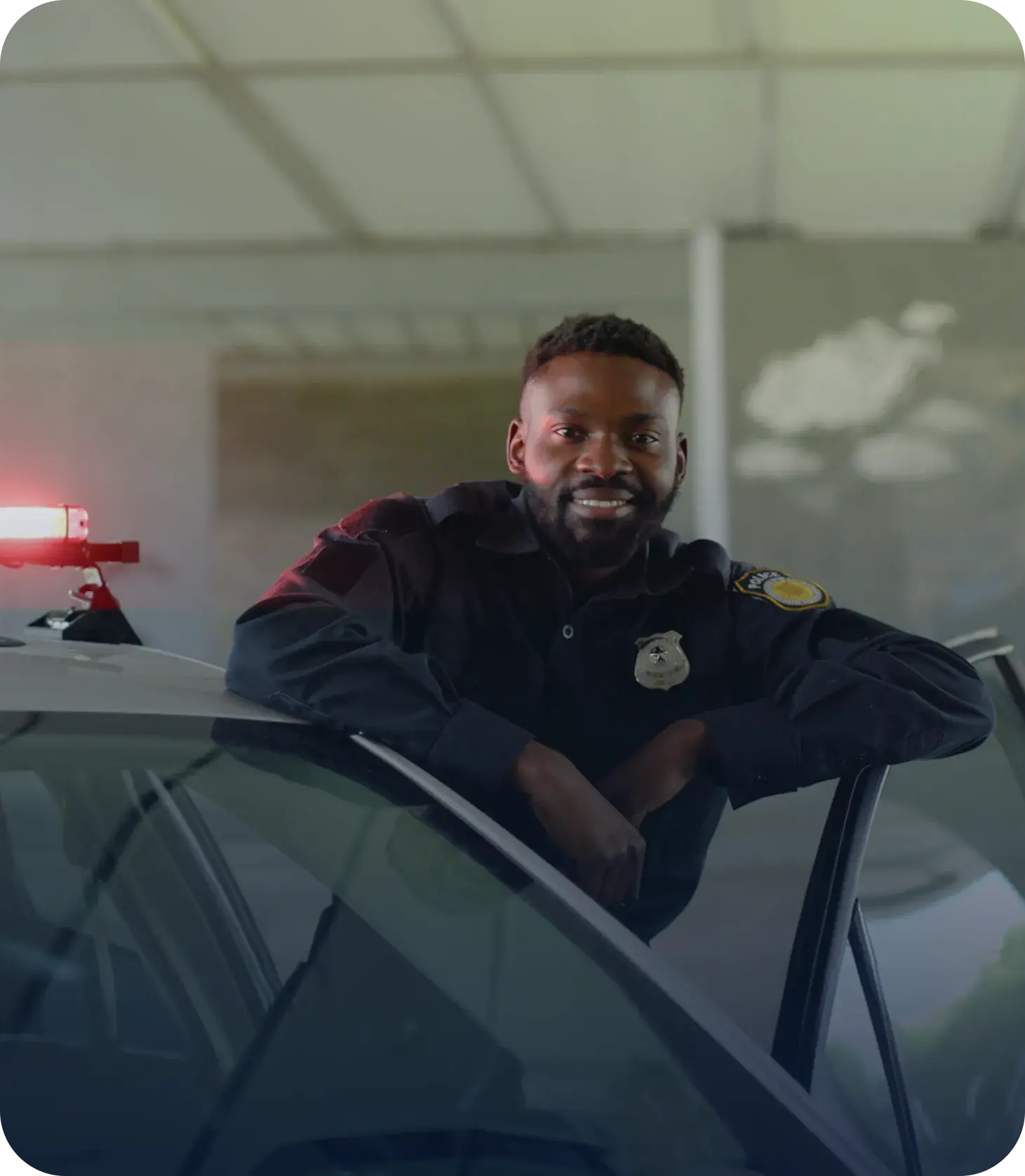 officer in his car with satisfaction about performance